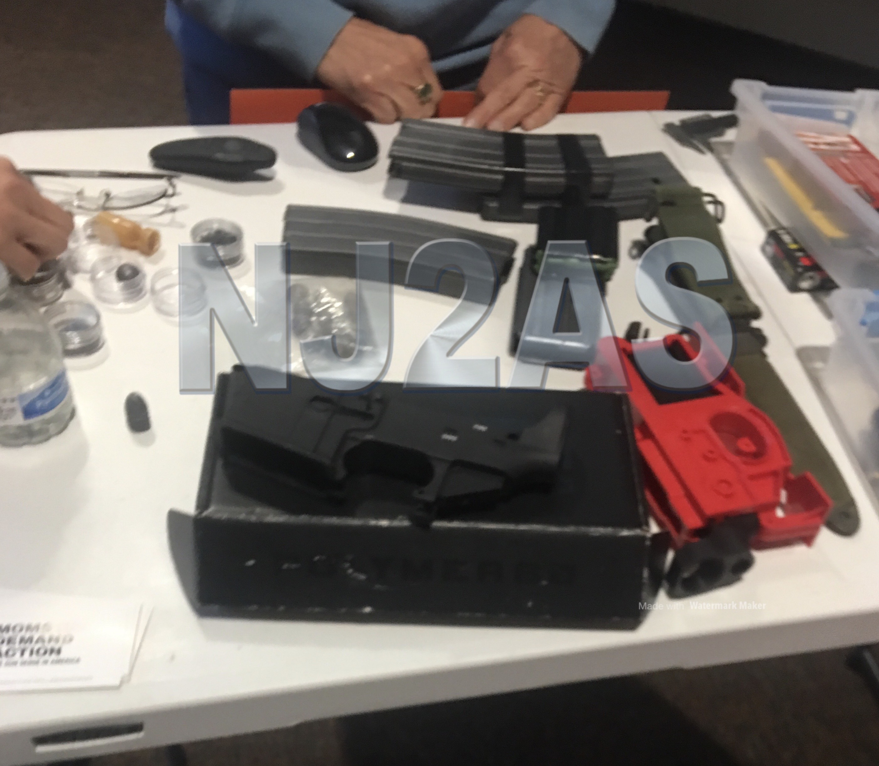 Moms Demand Action hosts event with illegal “large-capacity” magazines, “ghost gun” parts and tools, bayonet, and live ammunition